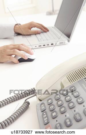 Stock Photo - Phone and laptop PC. Fotosearch