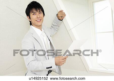Stock Image - Portrait of Japanese office worker. Fotosearch