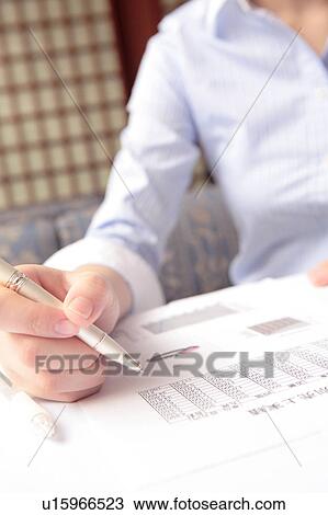 Stock Image - Office lady taking memo. Fotosearch