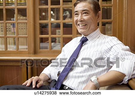 Smiling Japanese executive View Large Photo Image Stock Photo - Smiling Japanese executive. Fotosearch