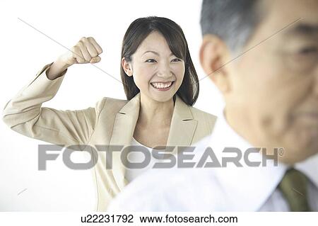 Secretary pretending to strike CEO View Large Photo Image Stock Image - Secretary pretending to strike CEO. Fotosearch