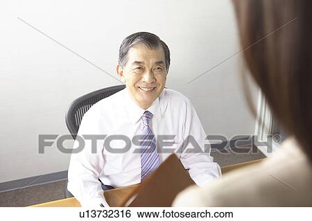 Smiling Japanese chief executive officer View Large Photo Image Stock Photograph - Smiling Japanese chief executive officer. Fotosearch