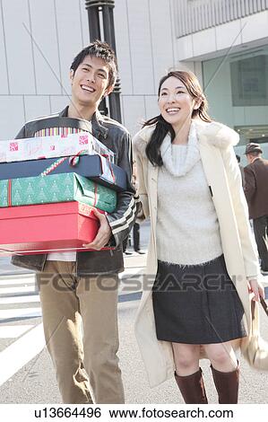 Stock Photograph - Japanese couple enjoy shopping. Fotosearch