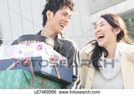 Japanese couple enjoy shopping View Large Photo Image Stock Photograph - Japanese couple enjoy shopping. Fotosearch