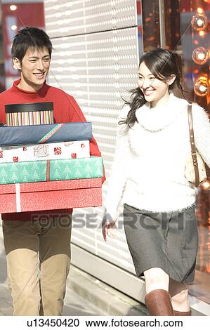 Japanese young couple enjoy shopping View Large Photo Image Stock Image - Japanese young couple enjoy shopping. Fotosearch