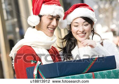 Japanese young couple enjoy shopping View Large Photo Image Stock Image - Japanese young couple enjoy shopping. Fotosearch