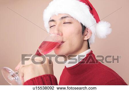 Stock Image - Man drinking champagne. Fotosearch