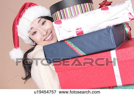 Stock Photo - Woman having a lot of boxes. Fotosearch