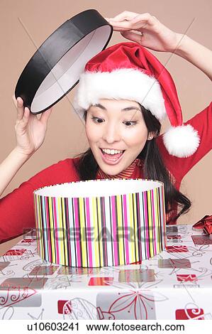 Woman opening a box View Large Photo Image Stock Image - Woman opening a box. Fotosearch