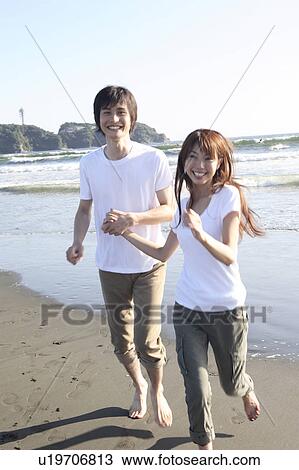Stock Image - Japanese couple in Enoshima. Fotosearch