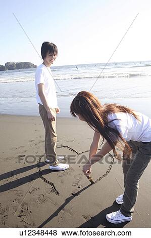Stock Photo - Japanese couple in Enoshima. Fotosearch