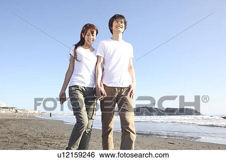 Stock Photograph - Japanese couple in Enoshima. Fotosearch
