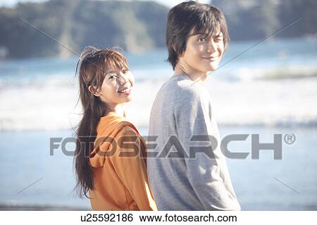 Stock Photograph - Japanese couple in Enoshima. Fotosearch