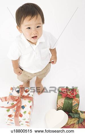 Stock Photography - Baby with present. Fotosearch