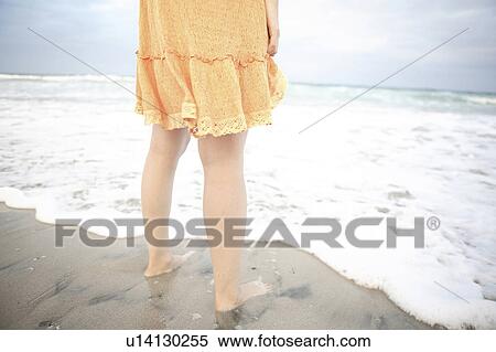 Back figure of Japanese woman standing barefeet on a beach View Large Photo Image Stock Photography - Back figure of Japanese woman standing barefeet on a beach. Fotosearch