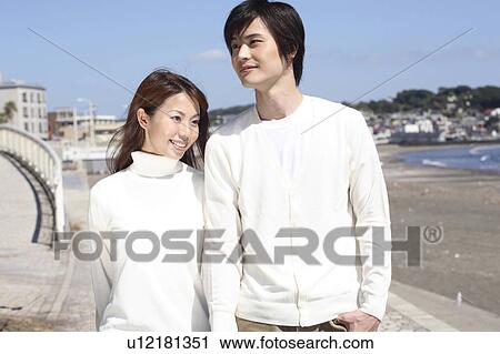 Stock Image - Japanese couple in Enoshima. Fotosearch