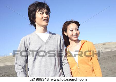 Stock Image - Japanese couple in Enoshima. Fotosearch