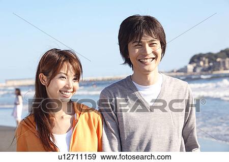 Stock Photo - Japanese couple in Enoshima. Fotosearch