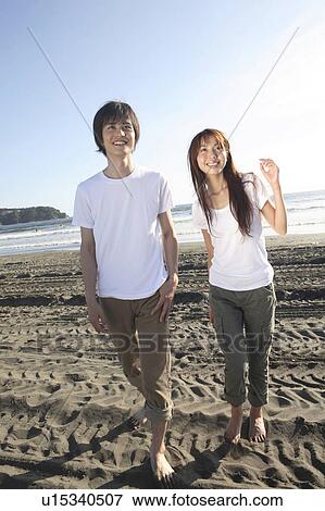 Stock Photo - Japanese couple in Enoshima. Fotosearch