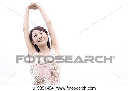Japanese woman stretching View Large Photo Image Picture - Japanese woman stretching. Fotosearch
