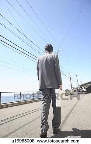 Stock Photo - Back figure of Japanese office worker. Fotosearch