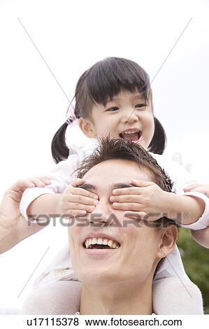 Stock Photo - Girl lifted up to father's shoulders. Fotosearch