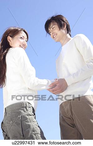 Stock Image - Japanese couple in Enoshima. Fotosearch