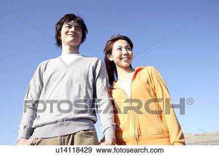 Stock Photo - Japanese couple in Enoshima. Fotosearch