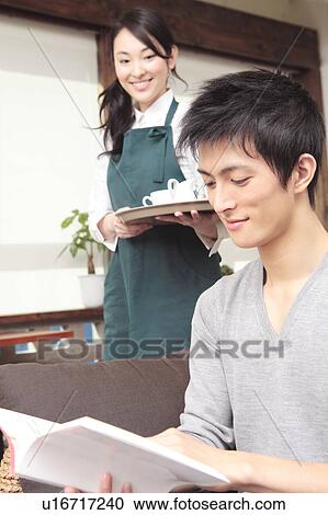 Japanese man reading a book View Large Photo Image Stock Image - Japanese man reading a book. Fotosearch