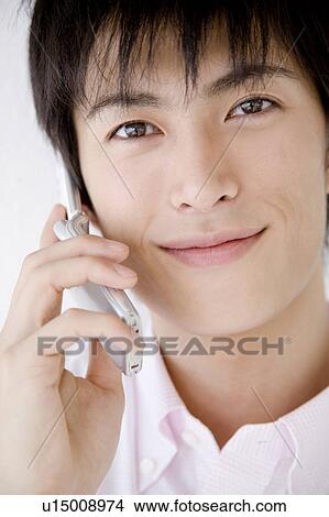 Picture - Man talking with a cell phone. Fotosearch