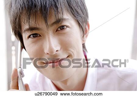 Stock Photo - Smiling Japanese man. Fotosearch