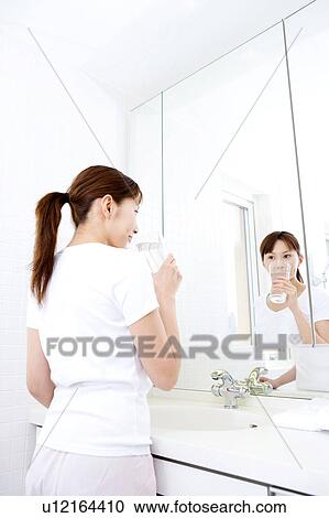 Japanese woman gargling View Large Photo Image Stock Image - Japanese woman gargling. Fotosearch