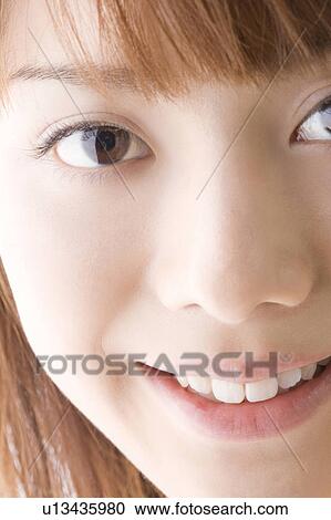 Stock Image - Smiling Japanese woman. Fotosearch