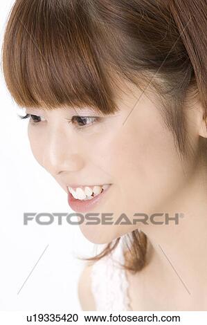 Stock Image - Smiling Japanese woman. Fotosearch