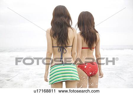 Stock Image - Back figure of Japanese weman in swimsuit. Fotosearch