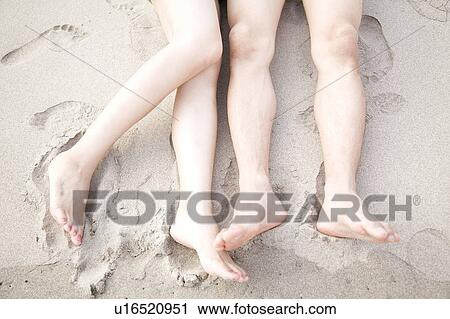 Foot of couple on a beach View Large Photo Image Stock Image - Foot of couple on a beach. Fotosearch