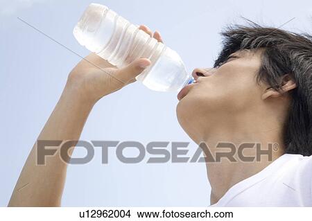 Japanese man drinking a water View Large Photo Image Picture - Japanese man drinking a water. Fotosearch