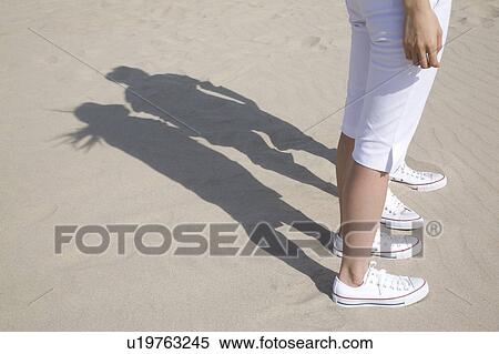 Stock Photography - Shadows on a beach. Fotosearch