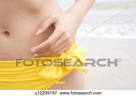 Stock Photo - Waist of Japanese woman in swimsuit. Fotosearch