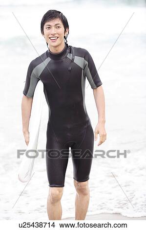 Picture - Young Japanese surfer. Fotosearch