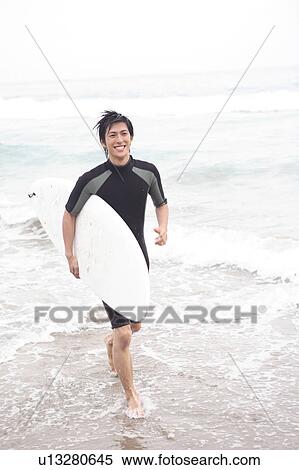 Young Japanese surfer View Large Photo Image Stock Photography - Young Japanese surfer. Fotosearch