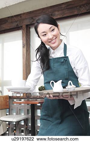 Stock Image - Japanese waitress. Fotosearch