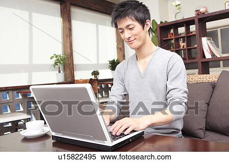 Man operating a PC View Large Photo Image Stock Photography - Man operating a PC. Fotosearch