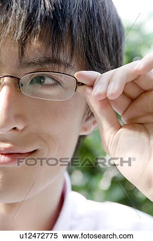 Man wearing glasses View Large Photo Image Stock Photography - Man wearing glasses. Fotosearch