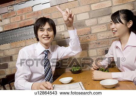 Office worker ordering food at bar View Large Photo Image Stock Image - Office worker ordering food at bar. Fotosearch