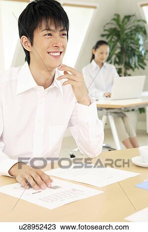 Smiling office worker View Large Photo Image Stock Image - Smiling office worker. Fotosearch