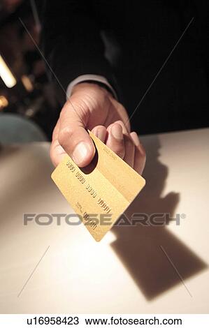 Japanese executive checking by credit card View Large Photo Image Stock Image - Japanese executive checking by credit card. Fotosearch