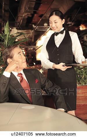 Japanese executive enjoyi talking with waitress View Large Photo Image Stock Photography - Japanese executive enjoyi talking with waitress. Fotosearch