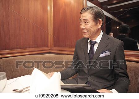 Stock Photography - Smiling Japanese executive. Fotosearch