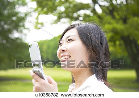 Stock Image - Smiling Japanese woman. Fotosearch